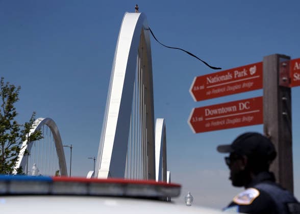 Activist Protesting Iran War Atop Frederick Douglass Bridge, in Washington DC, USA.Activist Protesting Iran War Atop Frederick Douglass Bridge, in Washington DC, USA. Activist Guido Reichstadter stands atop the Frederick Douglass Memorial Bridge as protesters below gather in support in Washington DC, USA, on May 05, 2026. Reichstadter climbed onto the bridge on May 1 and has remained there in protest of what he described as the Trump regime s war in Iran and against AI development. Washington USA  Copyright: xMatrixxImagesx xGentxShkullakux