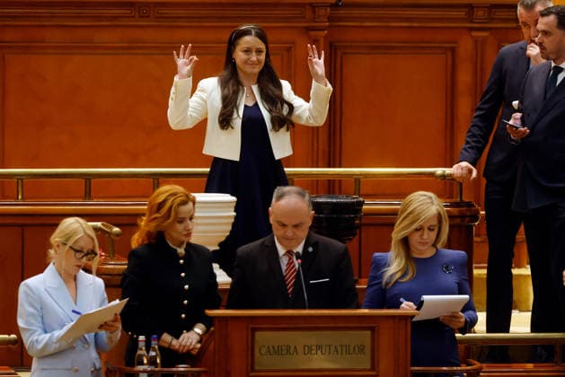 (260506) -- BEIJING, May 6, 2026 -- A member of Romania s bicameral parliament votes during a no-confidence vote against Prime Minister Ilie Bolojan s government at Parliament Palace in Bucharest, Romania, May 5, 2026. Romania s bicameral parliament passed a no-confidence motion against Prime Minister Ilie Bolojan s government on Tuesday, with 281 votes in favor and 4 against, bringing down the government, according to the parliament s live broadcast of the vote. (Photo by Xinhua) XINHUA PHOTOS OF THE DAY CristianxCristel 