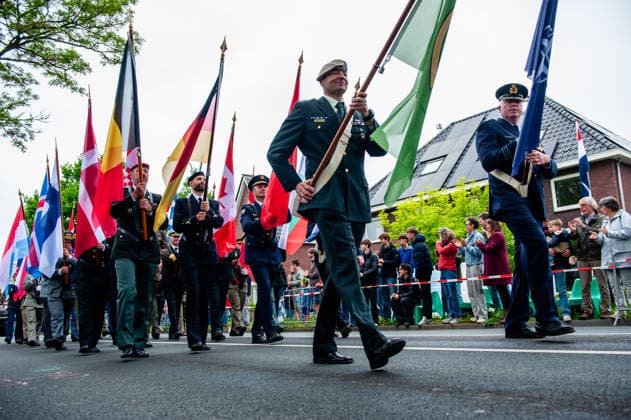 Liberation Day parade held in Wageningen - 05 May 2026 A group of servicemen seen carrying flags from several countries during the parade. The Liberation Parade reunites veterans and military successors to pay tribute to all those who gave their lives during WWII and to international military cooperation. Like in previous years, Canadian and English WWII veterans led the parade. Wageningen Netherlands Copyright: xAnaxFernandezx xSOPAxImagesx Ana_Fernandez_05052026_LiberationDayWageningen_017