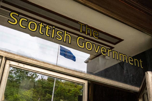 Images before the Scottish elections in Edinburgh, UK - 05 May 2026 The European Union flag is seen reflected underneath a banner title of the Scottish Government. A collection of illustrative photographs made before the Scottish Parliamentary elections. On the 7th May 2026, voters in Scotland will choose their next government in an election that is being seen as the firing of a starting pistol for a renewed push for Scottish Independence. Current polls show the Independence-supporting parties, the SNP and the Greens will form a majority bloc. In the event of their victory, the SNP state that on day one, they will table a motion to schedule a future independence referendum. Edinburgh United Kingdom Copyright: xNeilxMiltonx xSOPAxImagesx L1000096