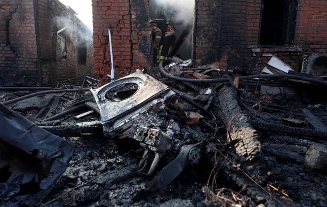 The engine of a Russian strike drone lies among the fire-stricken debris outside a private house, Kharkiv, Ukraine, May 6, 2026. On Wednesday morning, Russian troops attacked Kharkiv with Shahed-type drones. Strikes on residential areas in the Novobavarskyi and Shevchenkivskyi districts injured two people. (Photo by Viacheslav Madiievskyi Ukrinform) Russian drone destroys house in Kharkiv  Copyright: xViacheslavxMadiievskyix