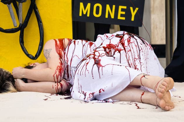 Climate Activists Pour Fake Blood over Protesters at Mock Petrol Pump outside Shell Centre, London, UK 6 May 2026 Activists lie on the ground in front of a mock petrol pump reading Oil Profit$$$ for Oil Bo$$es as they are doused in red liquid resembling blood outside the Shell Centre, London, UK, on 6 May 2026, during a Fossil Free London protest targeting Shell ahead of an expected jump in quarterly profits amid the US-Iran conflict., Credit:Pete Speller Avalon London, United Kingdom  Copyright: xPetexSpellerx xAvalonx 1096871580