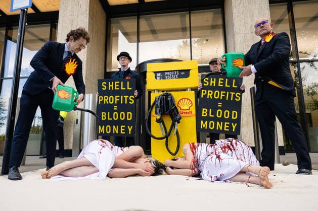Climate Activists Pour Fake Blood over Protesters at Mock Petrol Pump outside Shell Centre, London, UK 6 May 2026 Activists lie on the ground in front of a mock petrol pump reading Oil Profit$$$ for Oil Bo$$es as they are doused in red liquid resembling blood outside the Shell Centre, London, UK, on 6 May 2026, during a Fossil Free London protest targeting Shell ahead of an expected jump in quarterly profits amid the US-Iran conflict., Credit:Pete Speller Avalon London, United Kingdom  Copyright: xPetexSpellerx xAvalonx 1096871585