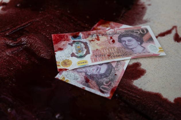 Climate Activists Pour Fake Blood over Protesters at Mock Petrol Pump outside Shell Centre, London, UK 6 May 2026 Activists lie on the ground in front of a mock petrol pump reading Oil Profit$$$ for Oil Bo$$es as they are doused in red liquid resembling blood outside the Shell Centre, London, UK, on 6 May 2026, during a Fossil Free London protest targeting Shell ahead of an expected jump in quarterly profits amid the US-Iran conflict., Credit:Pete Speller Avalon London, United Kingdom  Copyright: xPetexSpellerx xAvalonx 1096871618