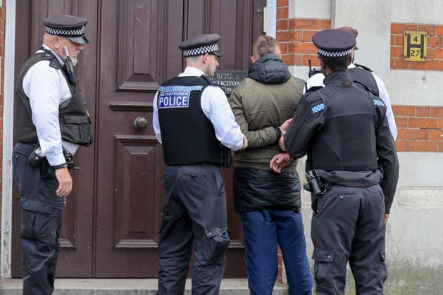 May 6, 2026, London, London, UK: London, UK. Police officers detain a man during a patrol in Stamford Hill, north London, as the Metropolitan Police announce a new 100-officer Community Protection Team to boost visibility and safeguard Jewish communities following recent antisemitic hate crime. London UK  - ZUMAl94_ 20260506_zaf_l94_011 Copyright: xDinendraxHariax
