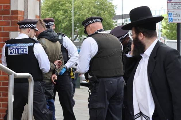 May 6, 2026, London, London, UK: London, UK. Police officers detain a man during a patrol in Stamford Hill, north London, as the Metropolitan Police announce a new 100-officer Community Protection Team to boost visibility and safeguard Jewish communities following recent antisemitic hate crime. London UK  - ZUMAl94_ 20260506_zaf_l94_013 Copyright: xDinendraxHariax