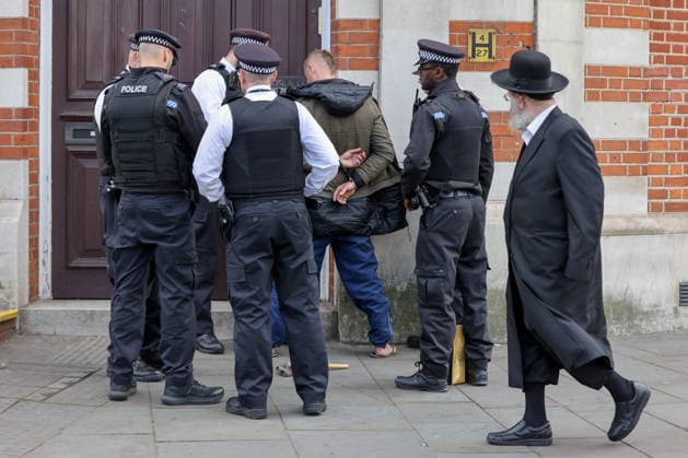 May 6, 2026, London, London, UK: London, UK. Police officers detain a man during a patrol in Stamford Hill, north London, as the Metropolitan Police announce a new 100-officer Community Protection Team to boost visibility and safeguard Jewish communities following recent antisemitic hate crime. London UK  - ZUMAl94_ 20260506_zaf_l94_016 Copyright: xDinendraxHariax