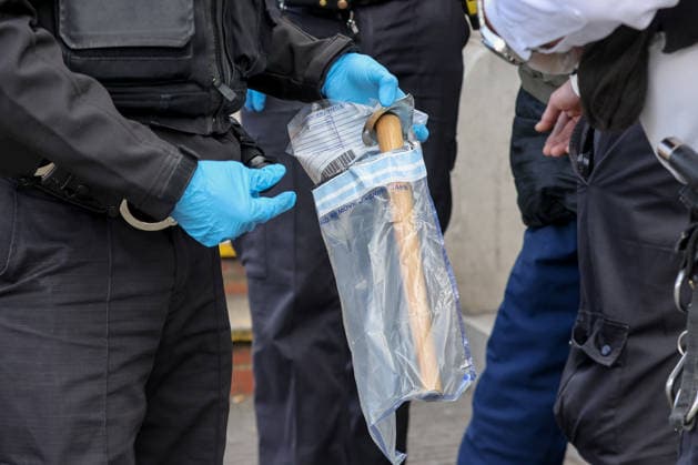 May 6, 2026, London, London, UK: London, UK. A weapon is placed in an evidence bag as police detain a man during a patrol in Stamford Hill, north London, while the Metropolitan Police announce a new 100-officer Community Protection Team to boost visibility and safeguard Jewish communities following recent antisemitic hate crime. London UK  - ZUMAl94_ 20260506_zaf_l94_018 Copyright: xDinendraxHariax