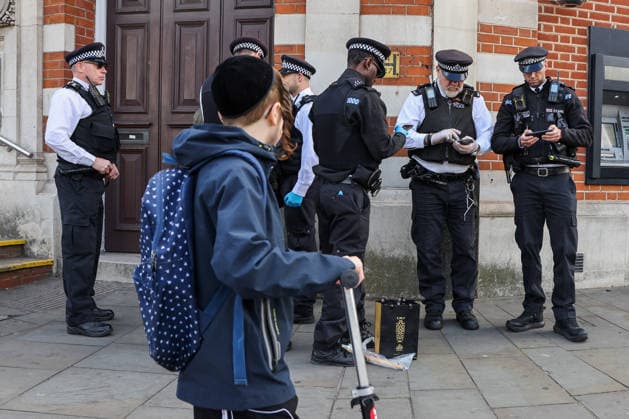 May 6, 2026, London, London, UK: London, UK. Police officers detain a man during a patrol in Stamford Hill, north London, as the Metropolitan Police announce a new 100-officer Community Protection Team to boost visibility and safeguard Jewish communities following recent antisemitic hate crime. London UK  - ZUMAl94_ 20260506_zaf_l94_020 Copyright: xDinendraxHariax