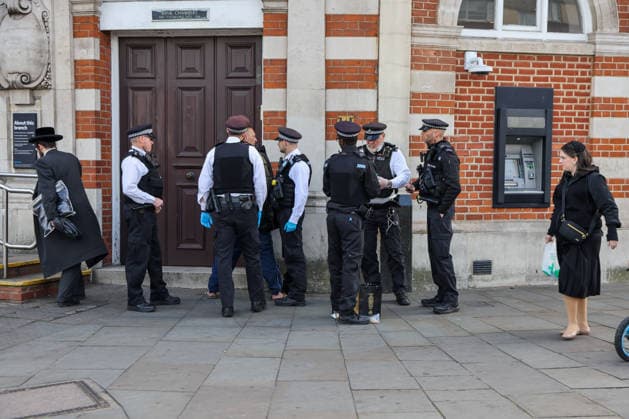May 6, 2026, London, London, UK: London, UK. Police officers detain a man during a patrol in Stamford Hill, north London, as the Metropolitan Police announce a new 100-officer Community Protection Team to boost visibility and safeguard Jewish communities following recent antisemitic hate crime. London UK  - ZUMAl94_ 20260506_zaf_l94_021 Copyright: xDinendraxHariax