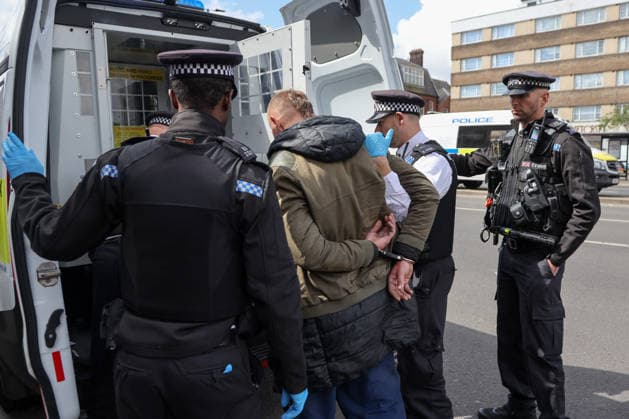 May 6, 2026, London, London, UK: London, UK. Police officers detain a man during a patrol in Stamford Hill, north London, as the Metropolitan Police announce a new 100-officer Community Protection Team to boost visibility and safeguard Jewish communities following recent antisemitic hate crime. London UK  - ZUMAl94_ 20260506_zaf_l94_022 Copyright: xDinendraxHariax