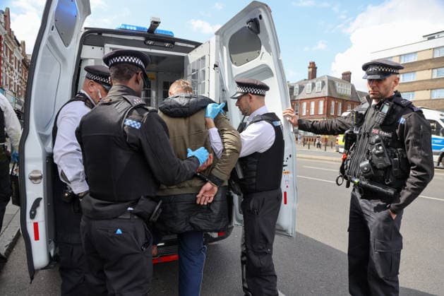 May 6, 2026, London, London, UK: London, UK. Police officers detain a man during a patrol in Stamford Hill, north London, as the Metropolitan Police announce a new 100-officer Community Protection Team to boost visibility and safeguard Jewish communities following recent antisemitic hate crime. London UK  - ZUMAl94_ 20260506_zaf_l94_023 Copyright: xDinendraxHariax