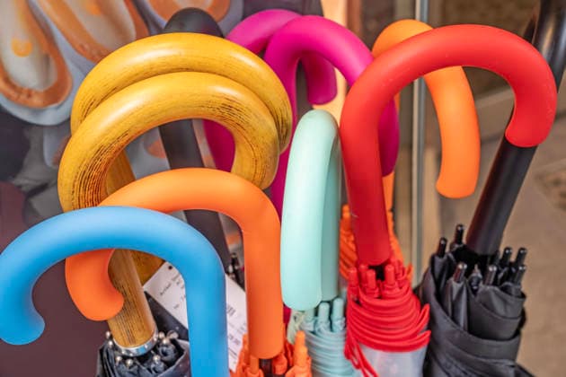 Colorful umbrellas for heavy rain and downpours, offer in a perfumery near Marienplatz, Munich, 6 May 2026 Germany, Munich, 6 May 2026, colorful umbrellas for heavy rain and downpours, offer in a perfumery near Marienplatz, stick umbrellas in all colors, brand derby, price 29 Euro, weather, storm, spring, Bavaria