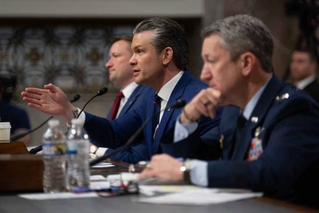 May 6, 2026, Washington, Dc, United States of America: U.S. Secretary of Defense Pete Hegseth, center, responds to a question during testimony before the Senate Armed Services Committee on Capitol Hill, April 30, 2026 in Washington, D.C. Sitting from left: Pentagon Chief Financial Officer Jules Hurst III, Defense Secretary Pete Hegseth and Chairman of the Joint Chiefs Gen. Dan Caine. Washington United States of America - ZUMAp138 20260506_zaa_p138_017 Copyright: xPo1xEricxBrann Dodx
