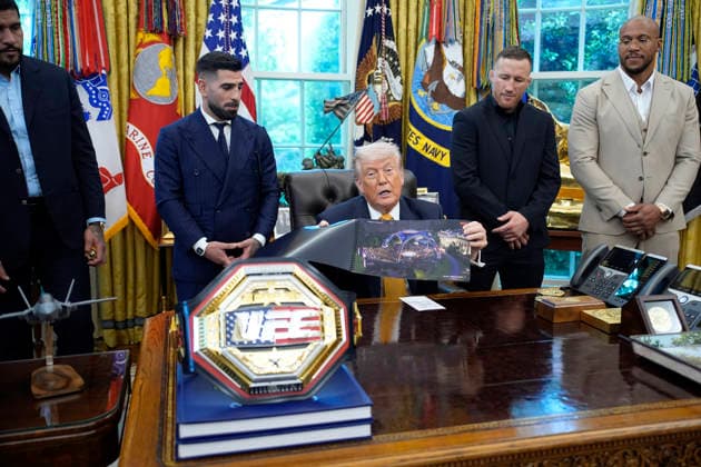 President Donald Trump, flanked by group of UFC fighters, speaks in the Oval Office of the White House in Washington, DC on Wednesday, May 6, 2026.  WASP20260506122 YurixGripas