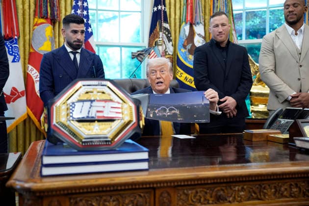 President Donald Trump, flanked by group of UFC fighters, speaks in the Oval Office of the White House in Washington, DC on Wednesday, May 6, 2026.  WASP20260506124 YurixGripas