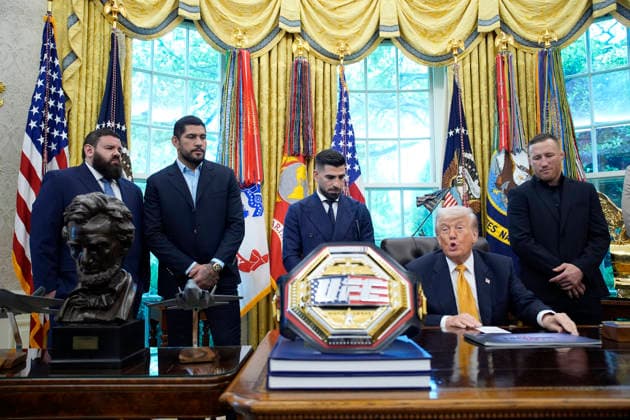 President Donald Trump, flanked by group of UFC fighters, speaks in the Oval Office of the White House in Washington, DC on Wednesday, May 6, 2026.  WASP20260506125 YurixGripas