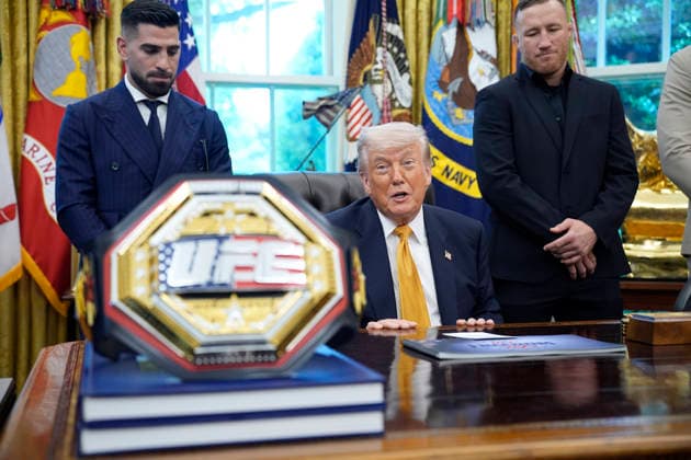 President Donald Trump, flanked by group of UFC fighters, speaks in the Oval Office of the White House in Washington, DC on Wednesday, May 6, 2026.  WASP20260506126 YurixGripas
