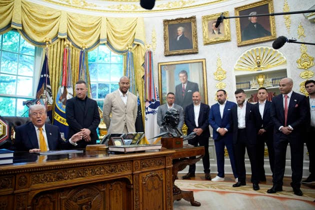 President Donald Trump, flanked by group of UFC fighters, speaks in the Oval Office of the White House in Washington, DC on Wednesday, May 6, 2026.  WASP20260506126 YurixGripas
