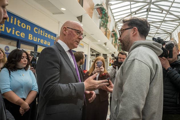 First Minister of Scotland John Swinney joins SNP candidate Alex Kerr campaigning in Hamilton - 06 May 2026 First Minister of Scotland John Swinney (left) meets a voter in the constituency. The day before the Scottish parliamentary elections, First Minister of Scotland John Swinney visits Hamilton in South Lanarkshire, the constituency of SNP candidate Alex Kerr to kick off the final day of campaigning by meeting potential voters and owners of local businesses. Hamilton United Kingdom Copyright: xNeilxMiltonx xSOPAxImagesx L1000860