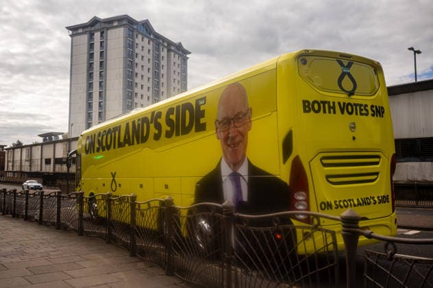 First Minister of Scotland John Swinney joins SNP candidate Alex Kerr campaigning in Hamilton - 06 May 2026 First Minister of Scotland John Swinney’s SNP Battle Bus draws up to the Hamilton office of candidate Alex Kerr. The day before the Scottish parliamentary elections, First Minister of Scotland John Swinney visits Hamilton in South Lanarkshire, the constituency of SNP candidate Alex Kerr to kick off the final day of campaigning by meeting potential voters and owners of local businesses. Hamilton United Kingdom Copyright: xNeilxMiltonx xSOPAxImagesx L1000574