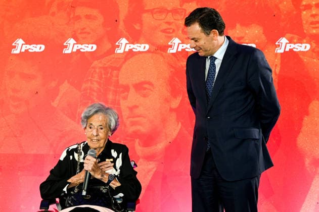 May 6, 2026, Lisbon, Lisbon, Portugal: PSD founding member CONCEIo¡oÆ’O MONTEIRO (L) speaks next to PSD President and Prime Minister LUoÂS MONTENEGRO (R) during the 52nd anniversary celebrations of the Social Democratic Party PSD in Lisbon. Lisbon Portugal - ZUMAr238 20260506_zip_r238_017 Copyright: xRicardoxRochax