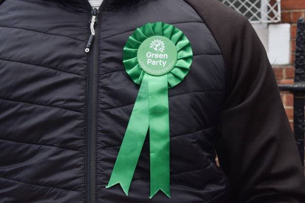May 7, 2026, London, England, United Kingdom: A member of the Green Party stands outside a polling station in London as local council elections take place. London United Kingdom - ZUMAv130 20260507_zip_v130_001 Copyright: xVukxValcicx