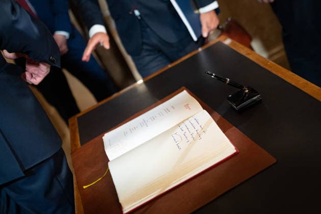 Friedrich Merz, German Chancellor, on his arrival and inscription in the Overseas Clubs Golden Book, with Peter Tschentscher, First Mayor, and Harald Vogelsang, President of the Overseas Club and Chairman of the Management Board of Hamburger Sparkasse 76 Great Overseas Day in Hamburg, April 2026 Ceremony at Hamburg City Hall, Hamburg Hamburg Germany City Hall