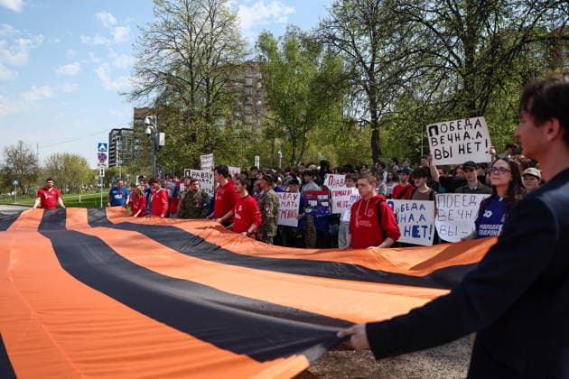 RUSSIA, MOSCOW - MAY 7, 2026: People unfurl a giant St George ribbon during an event titled You Cannot Cancel Truth and Memory! outside the German Embassy in Moscow. Sofya Sandurskaya TASS  92136528