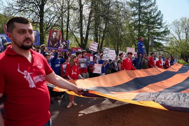 RUSSIA, MOSCOW - MAY 7, 2026: People unfurl a giant St George ribbon during an event titled You Cannot Cancel Truth and Memory! outside the German Embassy in Moscow. Sofya Sandurskaya TASS  92136532