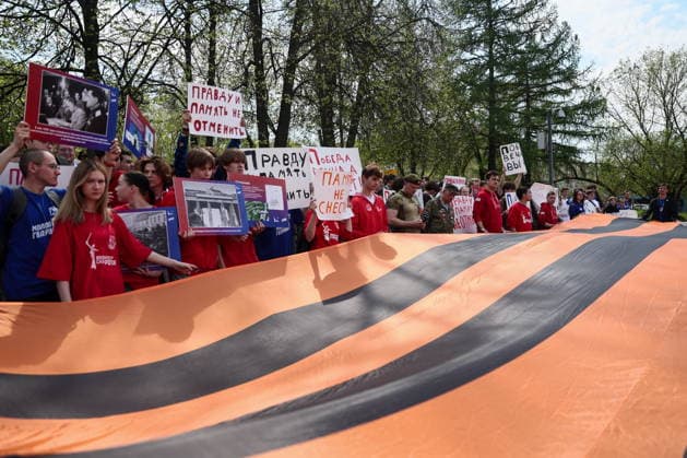 RUSSIA, MOSCOW - MAY 7, 2026: People unfurl a giant St George ribbon during an event titled You Cannot Cancel Truth and Memory! outside the German Embassy in Moscow. Sofya Sandurskaya TASS  92137157