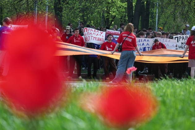 RUSSIA, MOSCOW - MAY 7, 2026: People unfurl a giant St George ribbon during an event titled You Cannot Cancel Truth and Memory! outside the German Embassy in Moscow. Sofya Sandurskaya TASS  92137159