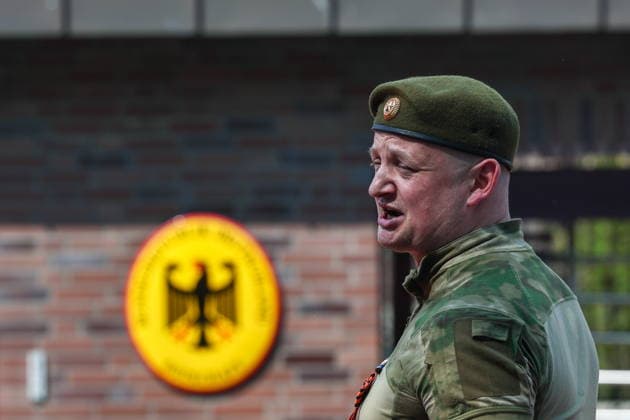 RUSSIA, MOSCOW - MAY 7, 2026: A man takes part in an event titled You Cannot Cancel Truth and Memory! outside the German Embassy in Moscow. Sofya Sandurskaya TASS  92137240