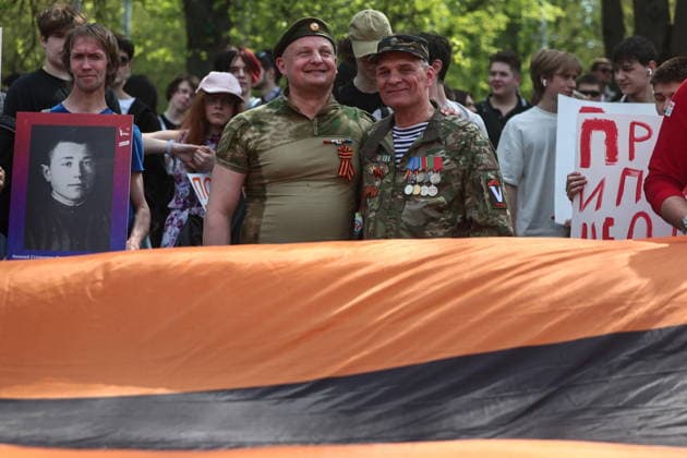 RUSSIA, MOSCOW - MAY 7, 2026: People unfurl a giant St George ribbon during an event titled You Cannot Cancel Truth and Memory! outside the German Embassy in Moscow. Sofya Sandurskaya TASS  92137213