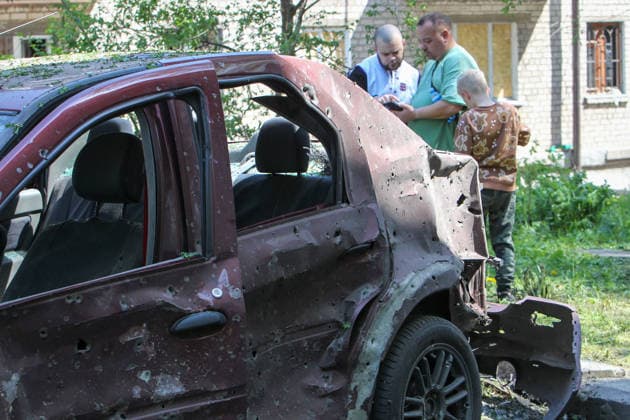 Shrapnel holes dot a car damaged by a Russian drone attack in Dnipro, Ukraine, on 7 May 2026. A 21-year-old pregnant woman and a 45-year-old man were injured as a result of the overnight attack. They received medical assistance at the scene. (Photo by Mykola Miakshykov Ukrinform) Overnight Russian drone attack on Dnipro  Copyright: xMykolaxMiakshykovx