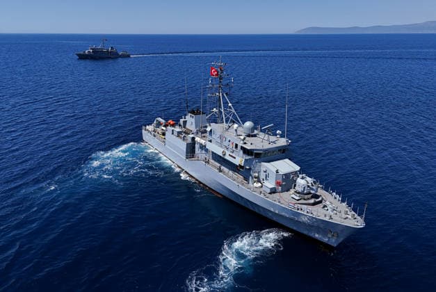 EFES-2026 Exercise in Izmir IZMIR, TURKIYE - MAY 07: An aerial view show Aydin-class mine hunter ship TCG Akcay (M-270) maneuvers in the deep blue sea, creating a large white wake and foam trail during a mine hunting operation as part of the EFES-2026 Exercise in Izmir on May 7, 2026. Conducted by the Turkish Armed Forces (TSK), the tactical exercise involved the detection and successful destruction of maritime mines to ensure safe passage in the region. Berkan Cetin Anadolu Izmir Turkey. Editorial use only. Please get in touch for any other usage.  Copyright: x2026xAnadoluxBerkanxCetinx