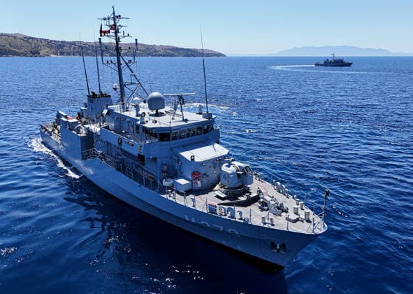 EFES-2026 Exercise in Izmir IZMIR, TURKIYE - MAY 07: An aerial view show Aydin-class mine hunter ship TCG Akcay (M-270) maneuvers in the deep blue sea, creating a large white wake and foam trail during a mine hunting operation as part of the EFES-2026 Exercise in Izmir on May 7, 2026. Conducted by the Turkish Armed Forces (TSK), the tactical exercise involved the detection and successful destruction of maritime mines to ensure safe passage in the region. Berkan Cetin Anadolu Izmir Turkey. Editorial use only. Please get in touch for any other usage.  Copyright: x2026xAnadoluxBerkanxCetinx