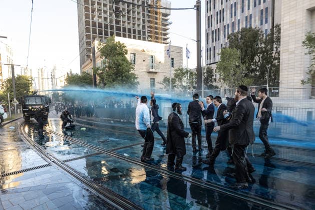Ultra-Orthodox Jews protest mandatory military service in Jerusalem JERUSALEM - MAY 7: Israeli police use water cannons to disperse Ultra-Orthodox Jewish (Haredi) protesters blocking roads by lying on the ground during a demonstration against the arrest of several yeshiva students over mandatory military service in West Jerusalem on May 7, 2026. Mostafa Alkharouf Anadolu Jerusalem Israel. Editorial use only. Please get in touch for any other usage.  Copyright: x2026xAnadoluxMostafaxAlkharoufx