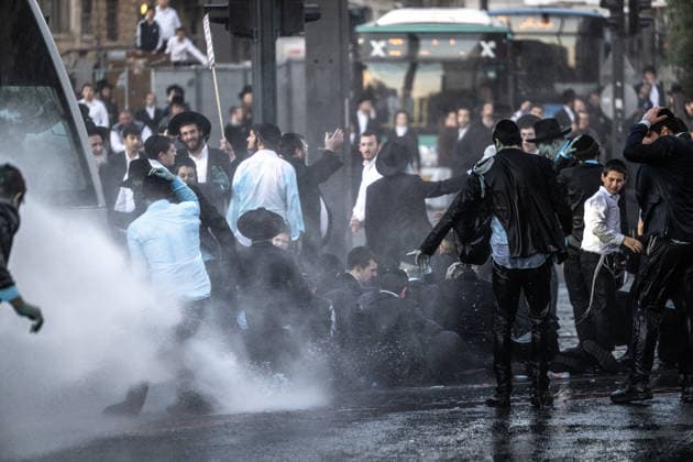 Ultra-Orthodox Jews protest mandatory military service in Jerusalem JERUSALEM - MAY 7: Israeli police use water cannons to disperse Ultra-Orthodox Jewish (Haredi) protesters blocking roads by lying on the ground during a demonstration against the arrest of several yeshiva students over mandatory military service in West Jerusalem on May 7, 2026. Mostafa Alkharouf Anadolu Jerusalem Israel. Editorial use only. Please get in touch for any other usage.  Copyright: x2026xAnadoluxMostafaxAlkharoufx