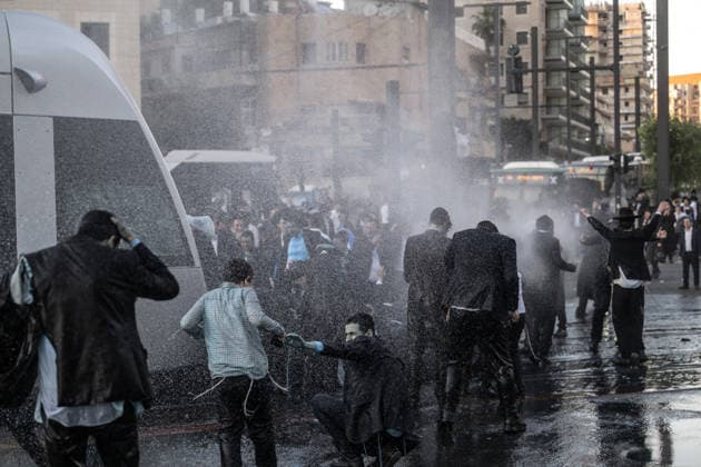 Ultra-Orthodox Jews protest mandatory military service in Jerusalem JERUSALEM - MAY 7: Israeli police use water cannons to disperse Ultra-Orthodox Jewish (Haredi) protesters blocking roads by lying on the ground during a demonstration against the arrest of several yeshiva students over mandatory military service in West Jerusalem on May 7, 2026. Mostafa Alkharouf Anadolu Jerusalem Israel. Editorial use only. Please get in touch for any other usage.  Copyright: x2026xAnadoluxMostafaxAlkharoufx