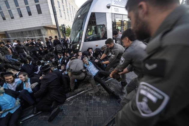 Ultra-Orthodox Jews protest mandatory military service in Jerusalem JERUSALEM - MAY 7: Israeli police use water cannons to disperse Ultra-Orthodox Jewish (Haredi) protesters blocking roads by lying on the ground during a demonstration against the arrest of several yeshiva students over mandatory military service in West Jerusalem on May 7, 2026. Mostafa Alkharouf Anadolu Jerusalem Israel. Editorial use only. Please get in touch for any other usage.  Copyright: x2026xAnadoluxMostafaxAlkharoufx
