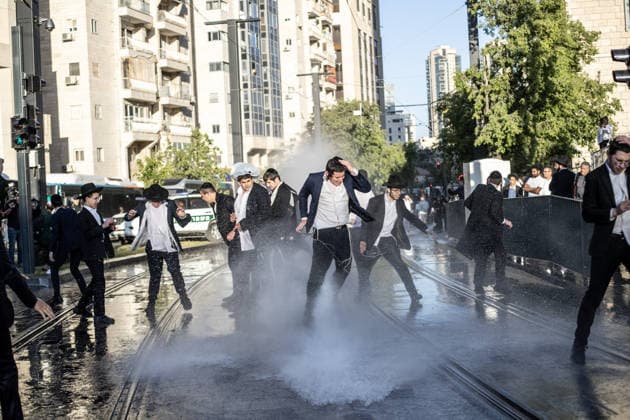 Ultra-Orthodox Jews protest mandatory military service in Jerusalem JERUSALEM - MAY 7: Israeli police use water cannons to disperse Ultra-Orthodox Jewish (Haredi) protesters blocking roads by lying on the ground during a demonstration against the arrest of several yeshiva students over mandatory military service in West Jerusalem on May 7, 2026. Mostafa Alkharouf Anadolu Jerusalem Israel. Editorial use only. Please get in touch for any other usage.  Copyright: x2026xAnadoluxMostafaxAlkharoufx