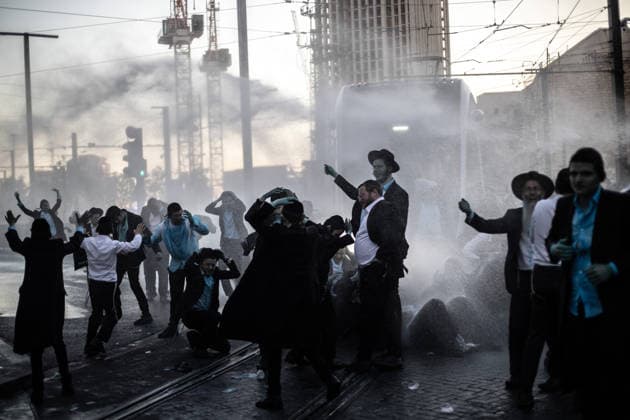 Ultra-Orthodox Jews protest mandatory military service in Jerusalem JERUSALEM - MAY 7: Israeli police use water cannons to disperse Ultra-Orthodox Jewish (Haredi) protesters blocking roads by lying on the ground during a demonstration against the arrest of several yeshiva students over mandatory military service in West Jerusalem on May 7, 2026. Mostafa Alkharouf Anadolu Jerusalem Israel. Editorial use only. Please get in touch for any other usage.  Copyright: x2026xAnadoluxMostafaxAlkharoufx
