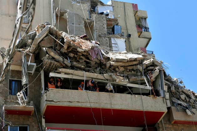 May 7, 2026, Beirut, Beirut, Lebanon: Lebanese civil defense members clear rubble from the site of a building destroyed by an Israeli air raid in Beirut southern suburb, a bastion for pro-Iranian Hezbollah. Israel confirmed it killed Ahmed Ghaleb Ballout, a commander in HezbollahÃ¢â‚¬â ¢s elite Radwan Force in the attack. Beirut Lebanon  - ZUMAn313 20260507_zip_n313_001 Copyright: xMarwanxNaamanix