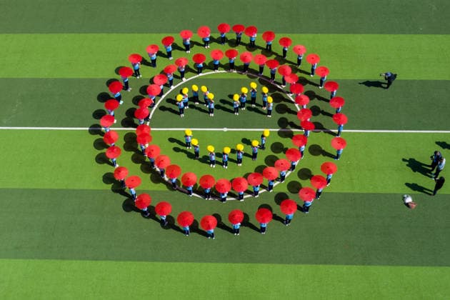 ZIBO, CHINA - MAY 07: Primary school students form a smiley face pattern on the playground to welcome the World Smile Day on May 7, 2026 in Zibo, Shandong Province of China. May 8 marks the World Smile Day.  Copyright: xVCGx 111639743391