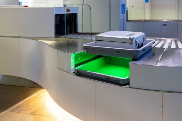 Opening of the new CT checkpoint at Nuremberg Airport, Nuremberg, 08 05 2026 Baggage tray with transport case on the conveyor system of the new CT checkpoint at Nuremberg Airport The system is used for the three-dimensional inspection of hand baggage at the passenger checkpoint Nuremberg Bavaria Germany 20260508-286A6792-M4000
