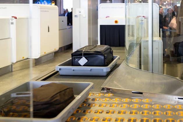 Opening of the new CT checkpoint at Nuremberg Airport, Nuremberg, 08 05 2026 Baggage tubs with suitcases and garments on the conveyor system of the new CT checkpoint at Nuremberg Airport CT scanners from Smiths Detection for passenger screening can be seen in the background Nuremberg Bavaria Germany 20260508-286A6913-M4000
