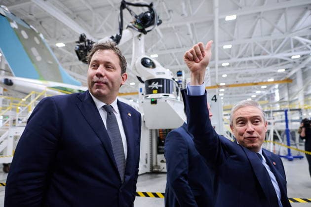 May 8, 2026, Toronto, On, Canada: German Vice-Chancellor and Federal Minister of Finance Lars Klingbeil, left, and Minister of Finance and National Revenue Francois-Philippe Champagne wave to workers during a tour of Bombardier s aircraft assembly centre in Mississauga, Ont., on Friday, May 8, 2026. Toronto Canada - ZUMAc35_ 20260508_zaf_c35_043 Copyright: xSammyxKoganx