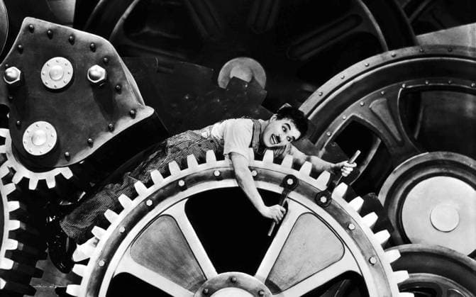 RECORD DATE NOT STATED Sir Charles Spencer Charlie Chaplin, KBE (1889-1977) in Modern Times (1936), a grim account of the automatization of the individual Sir Charles Spencer Charlie Chaplin, KBE (1889-1977) in Modern Times (1936), a grim account of the automatization of the individual Editorial use only. All other uses to be cleared with the copyright owner (World History Archive), in advance., WHA_043_0952.jpg, Charlie Chaplin; Modern Times; 1936; silent film; comedy; satire; industrialization; automation; individuality; dehumanization; factory; assembly line; social commentary; iconic; tramp; film star; actor; director; screen legend; black and white; classic cinema; slapstick; social issues; work; society; technology; machinery; hum Copyright: xWorldxHirsoryxArchivex