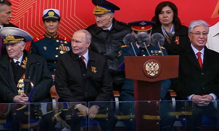 RUSSIA, MOSCOW - MAY 9, 2026: Vladimir Putin (2nd R front), President of Russia, and his counterpart Kassym-Jomart Tokayev (R front) of Kazakhstan attend a military parade in Red Square on Victory Day to mark 81 years since the victory of the Soviet Union over Nazi Germany in the Great Patriotic War, Eastern Front of World War II. Video screen grab. Best quality available. TASS  92218895